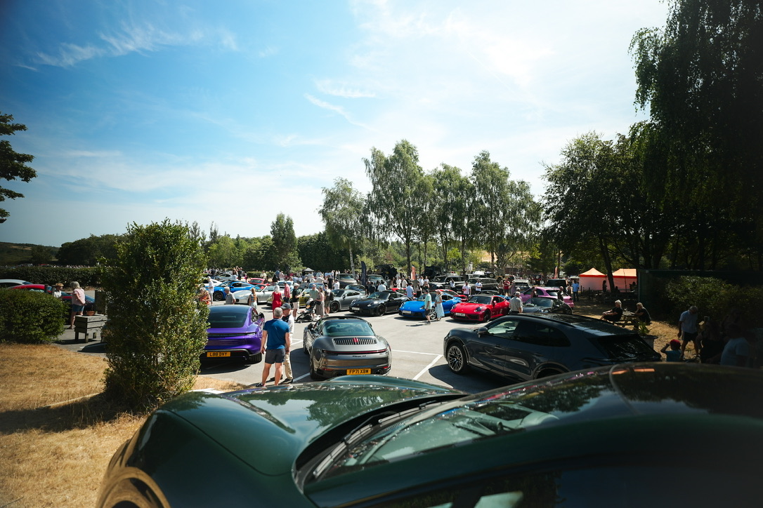 Wide view of the car park at a meet