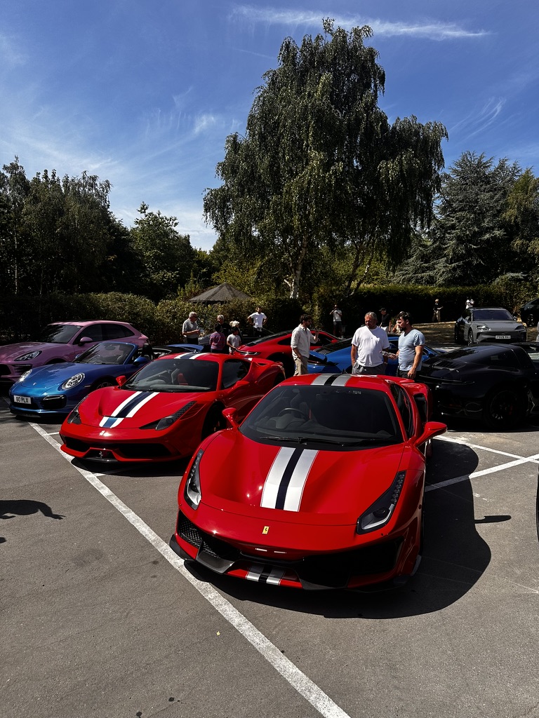 Three Ferraris parked together