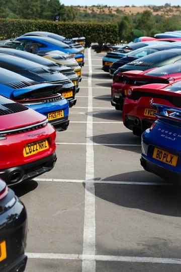 Row of Porsches, rear view
