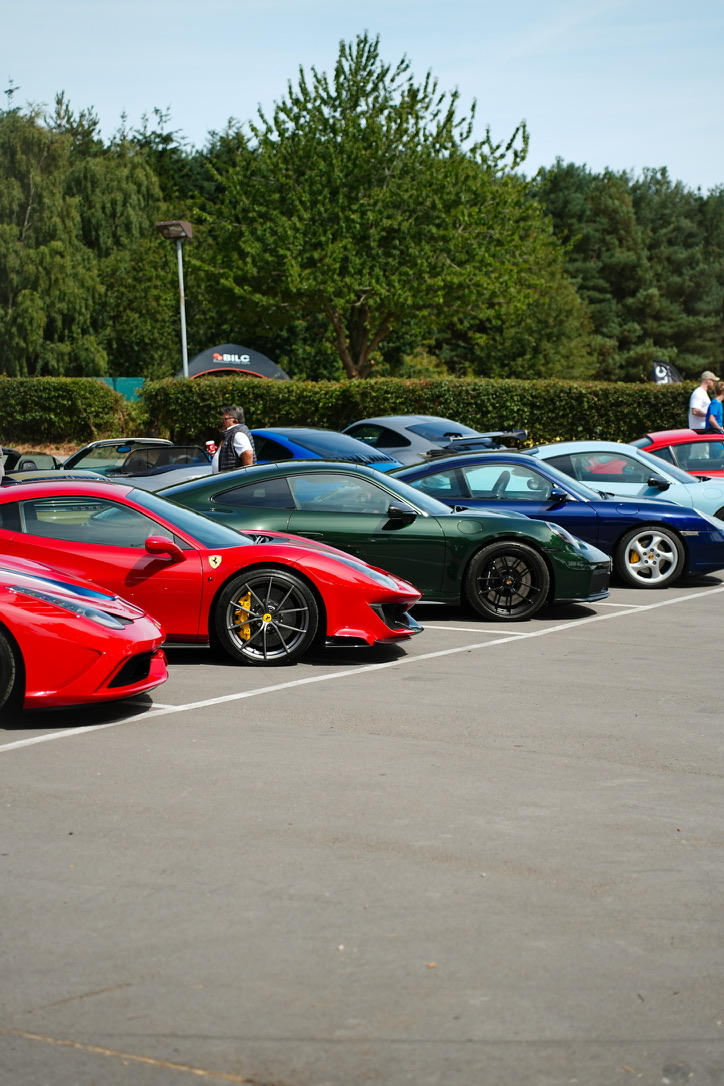 Ferraris and Porsches lined up