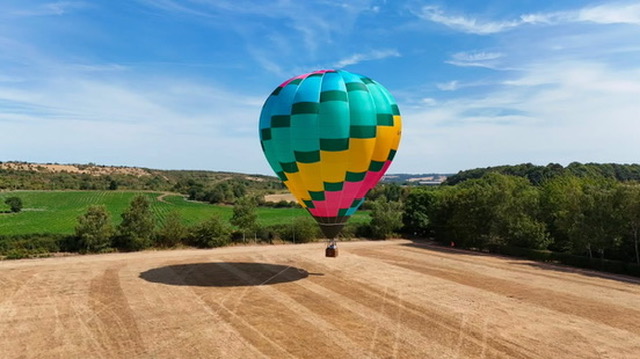 Hot air balloon landing in the field