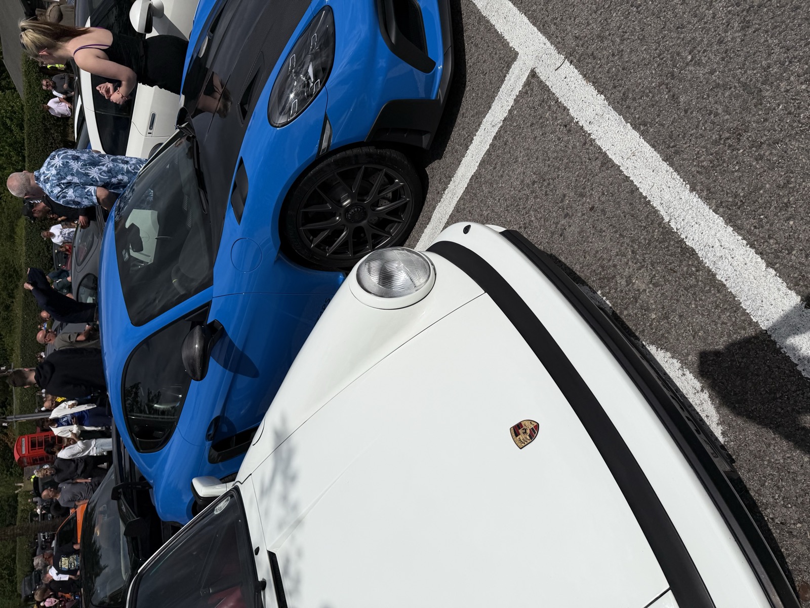 Porsche Cayman and 911 parked together